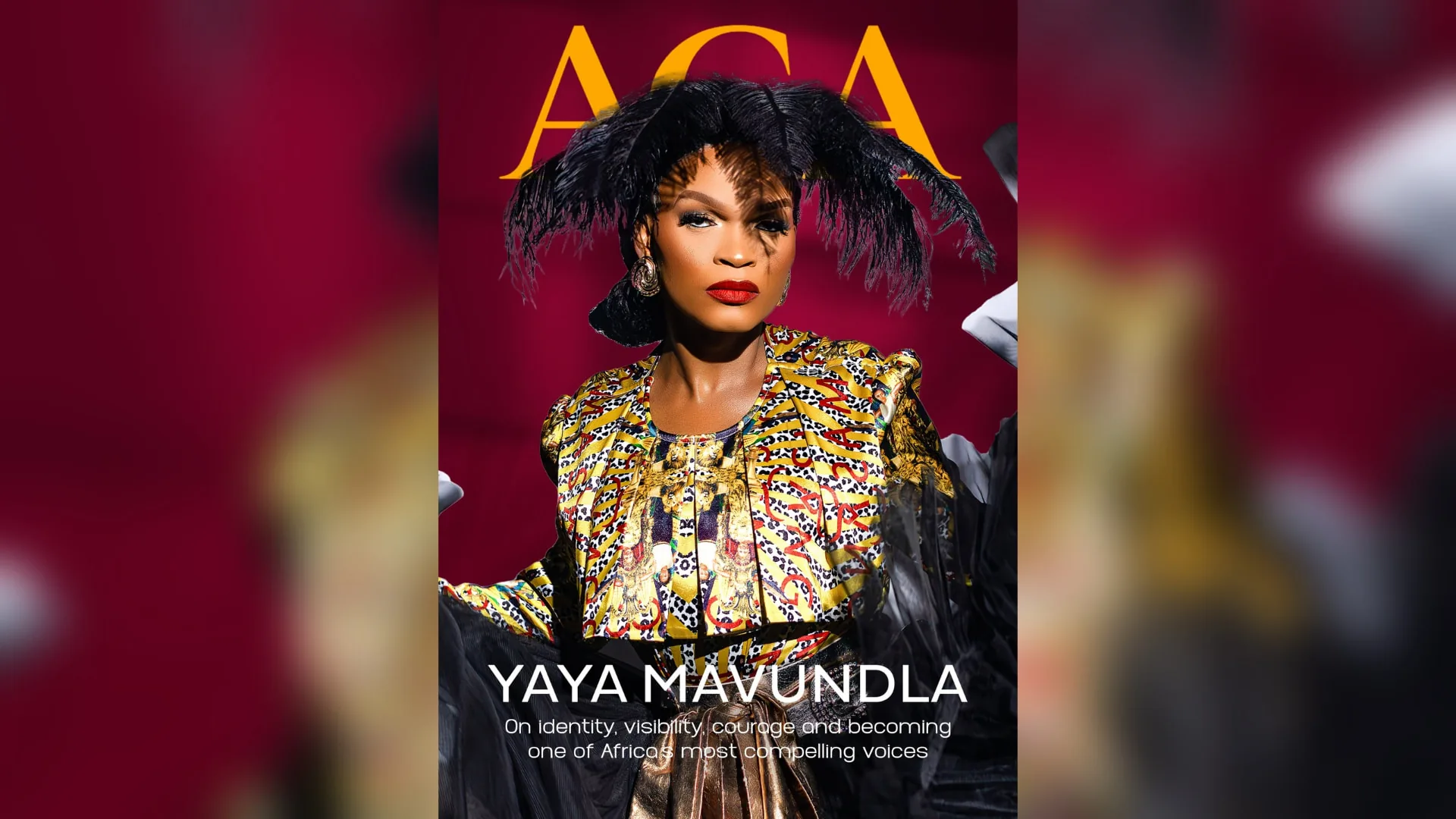 ACA Magazine cover: Yaya Mavundla in a black feather headpiece, gold earrings and a gold, black and red patterned jacket against a deep crimson backdrop, with the ACA masthead above and the cover line YAYA MAVUNDLA below, centred in a wide banner.